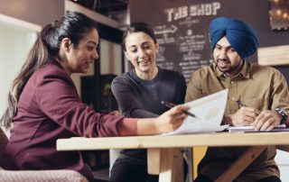 mrtgage broker finance broker with small business owner meeting